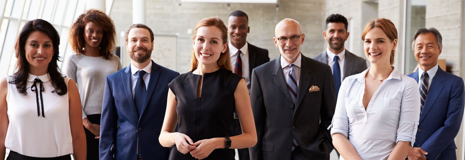 A group of people at the office smiling